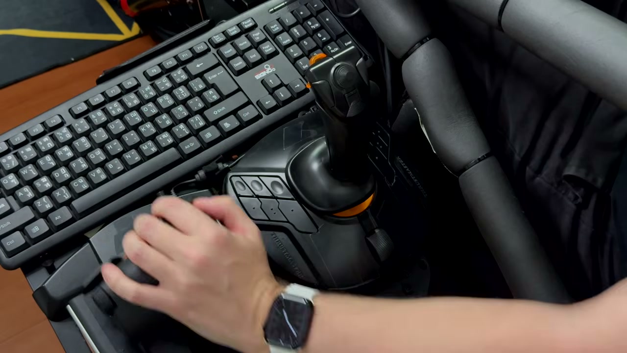 Thrustmaster throttle with accessible controls beside the joystick