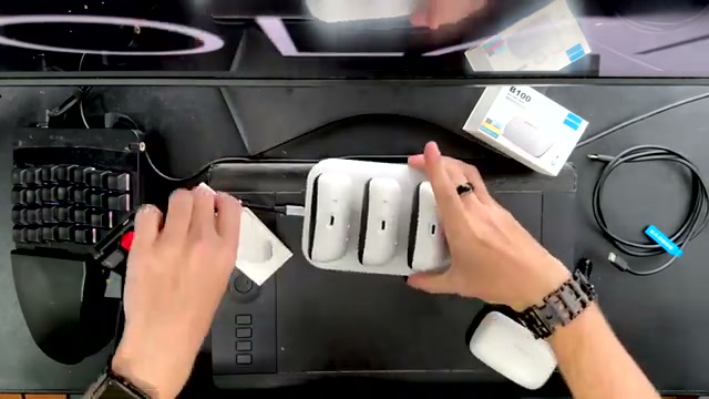 The BOBOVR BD3 dock and B100 batteries arranged during the review video